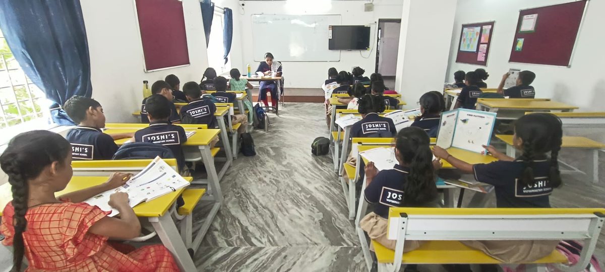 A teacher leading a lesson in a JVNS classroom
